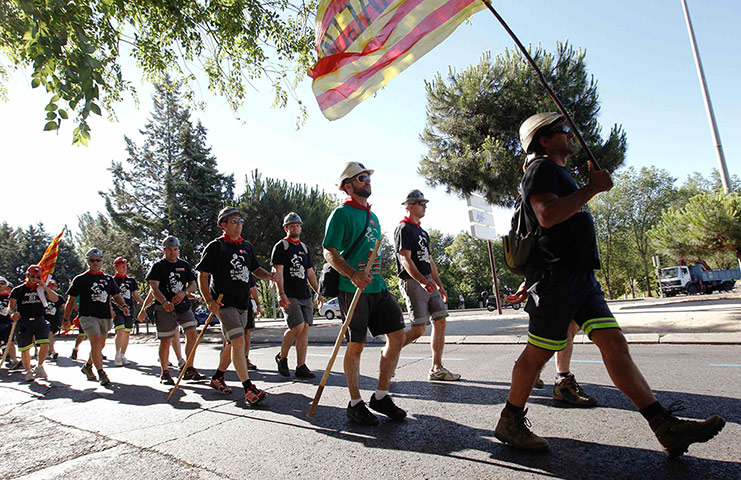 Longer view miners: Coal miners walk during the last stage of their march to Madrid