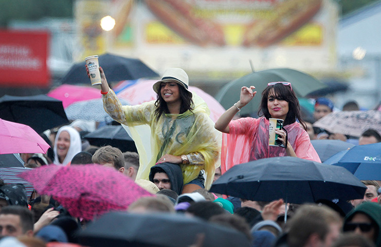Wet festivals: Festival goers amongst the crowd enjoy the performance at Wireless 