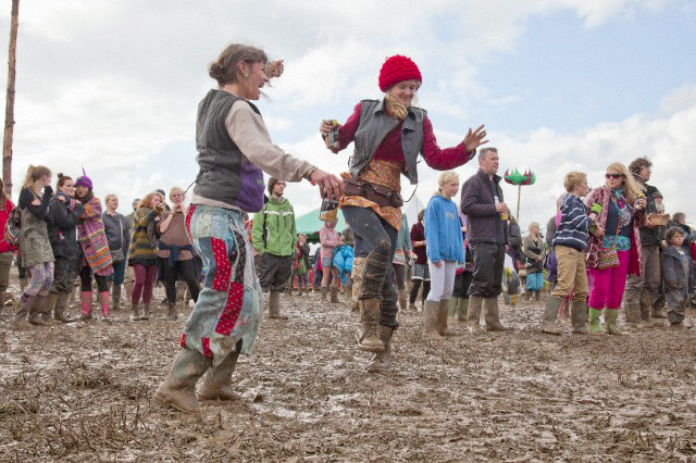 Wet festivals: Revellers dance in the mud at the Sunrise Celebration Festival in Somerset