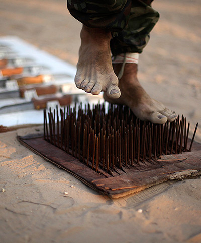 24 hours: Gaza Strip: A Palestinian boy performs exercises at a summer camp