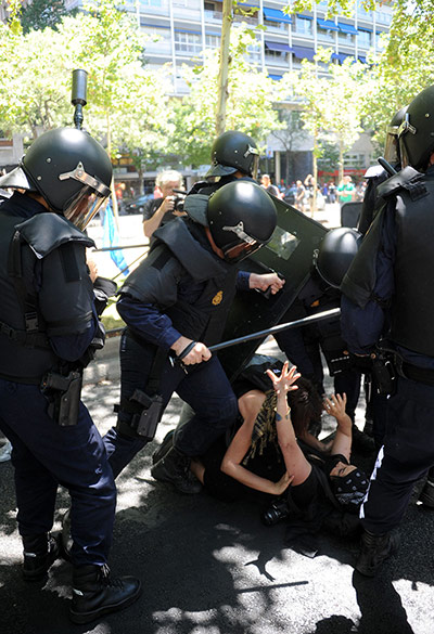 Picture desk live: Demosntrators are surrounded by riot police in Madrid