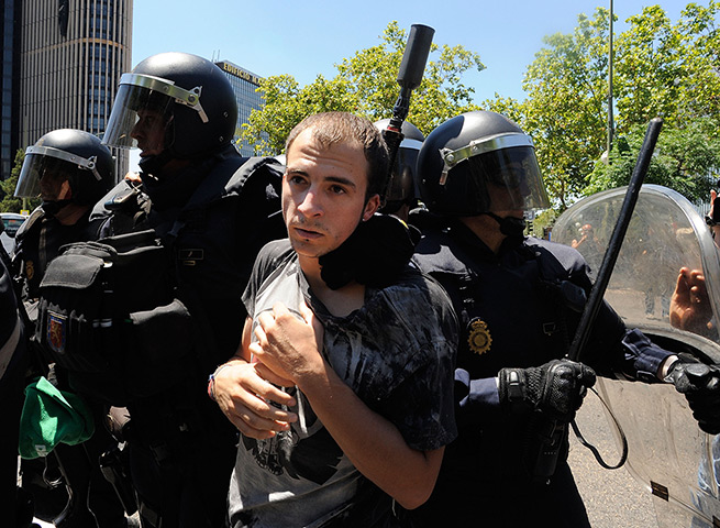 Miners reach Madrid: A protester is arrested by riot police