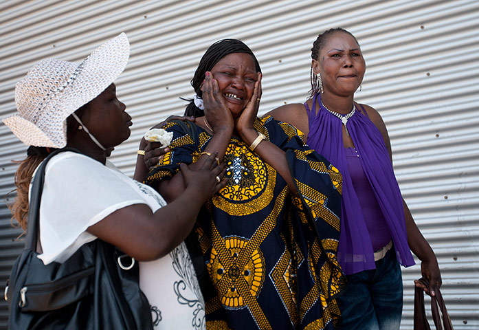 Picture desk live: A South sudanese worker cries as her children are deported from Israel