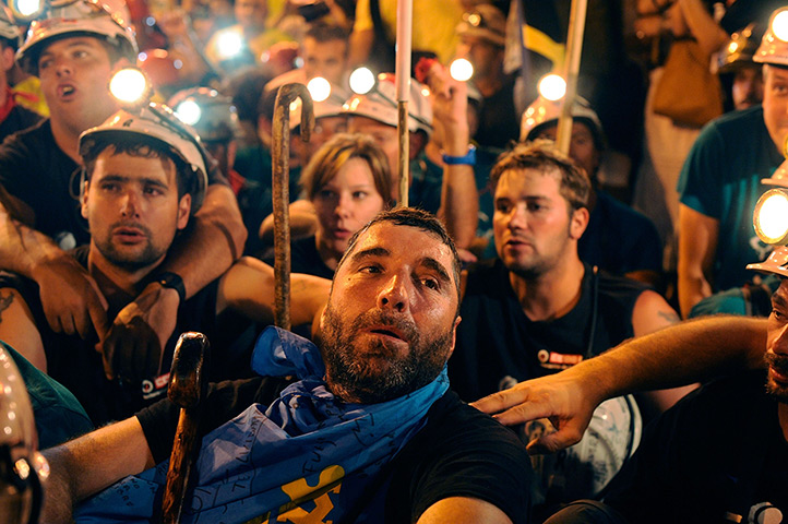 Spain miners: Miners rest after arriving at Puerta del Sol square 