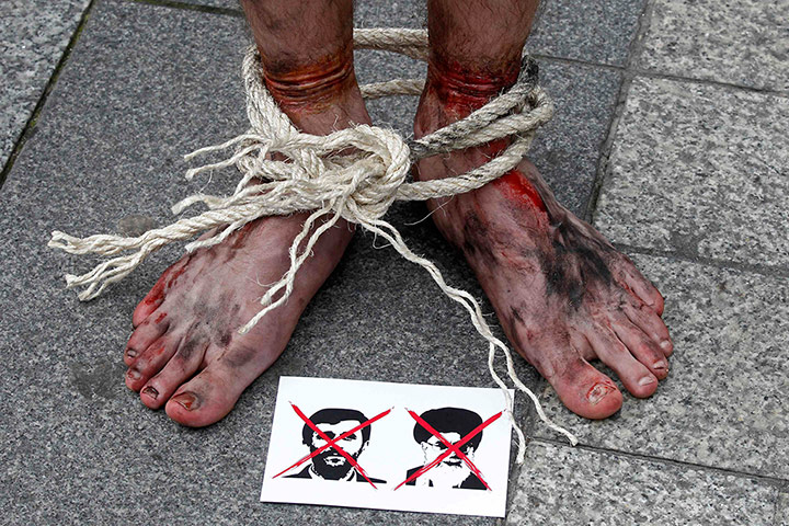 Iran reporters: Crossed out pictures of Iran's President