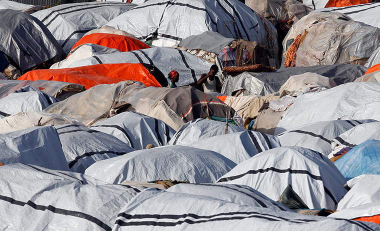 Mogadishu: A man and woman stands in an IDP camp in Mogadishu