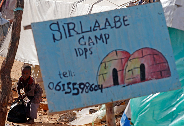 Mogadishu: A boy carries a plastic bag in Sirlaabe IDP camp in Mogadishu