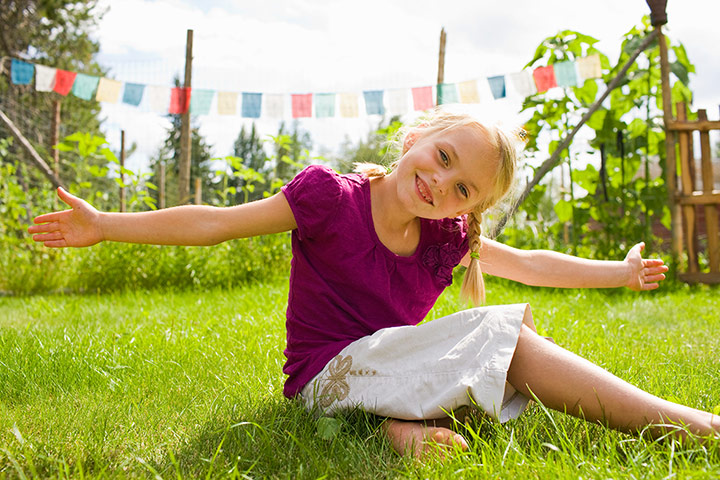Brita craft: Girl with outstretched arms in backyard