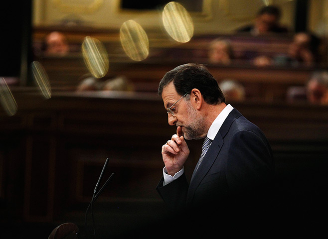 Week in business: Spain's Prime Minister Rajoy gestures as he addresses parliament in Madrid