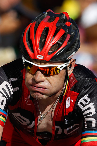 tour de france: Cadel Evans doesn't look impressed as he crosses the finish line 