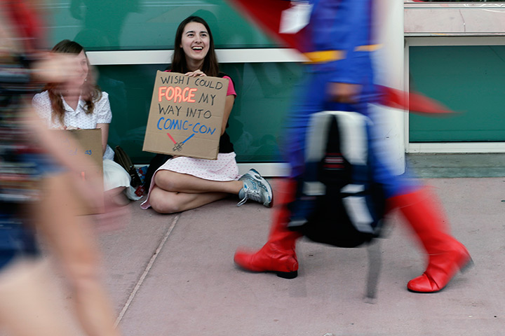 Comic con: Aaron Rickets holds a sign as she tries to gain entrance