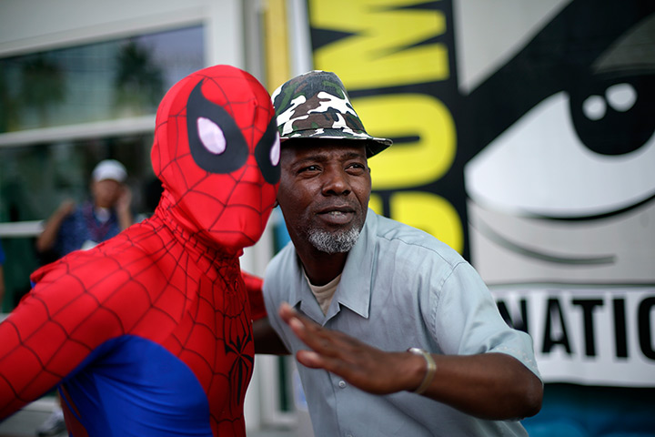 Comic con: Ray Senore poses with a man dressed as Spider-Man 