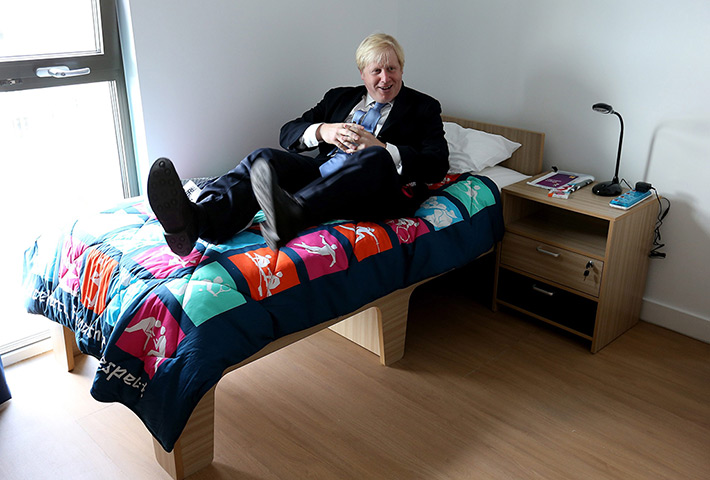 Olympic Village: Boris Johnson tests out a bed