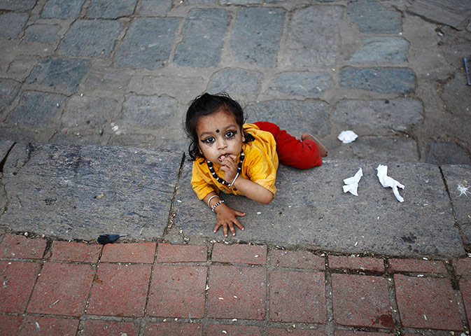 24 Hours: Kathmandu, Nepal: A child plays in Bashantapur Durbar Square
