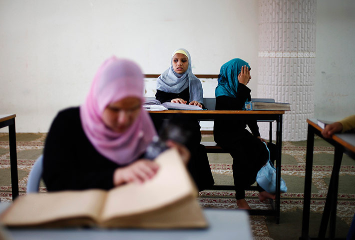 24 Hours: Gaza City: A visually impaired Palestinian girl reads a Braille Koran