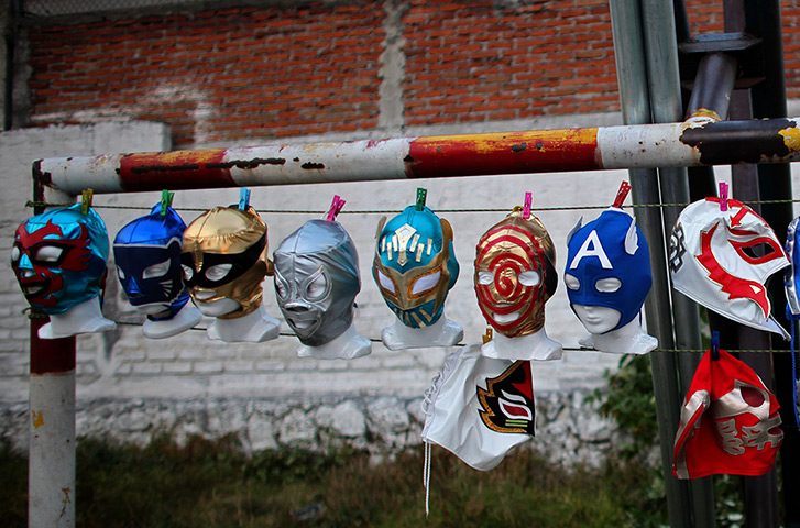 Lucha Libre, Mexico: Lucha Libre wrestling masks are attached with clothespins to a wire