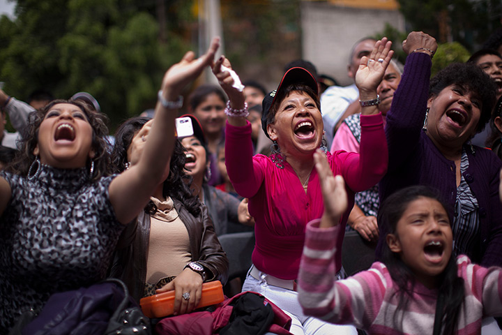 Lucha Libre, Mexico: Fans cheer as they watch wrestlers perform