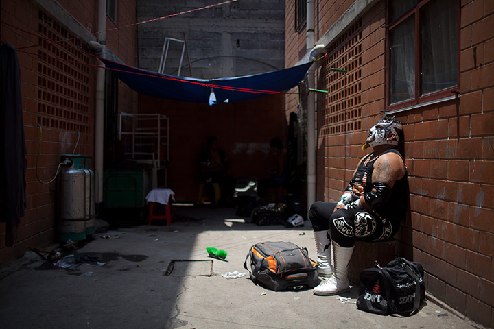 Lucha Libre, Mexico: Lucha Libre wrestler Lunathor rests in an alleyway