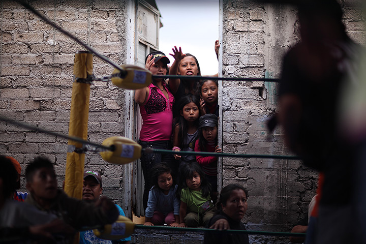 Lucha Libre, Mexico: Fans squeeze between two walls to watch a Caravan Super Tarin