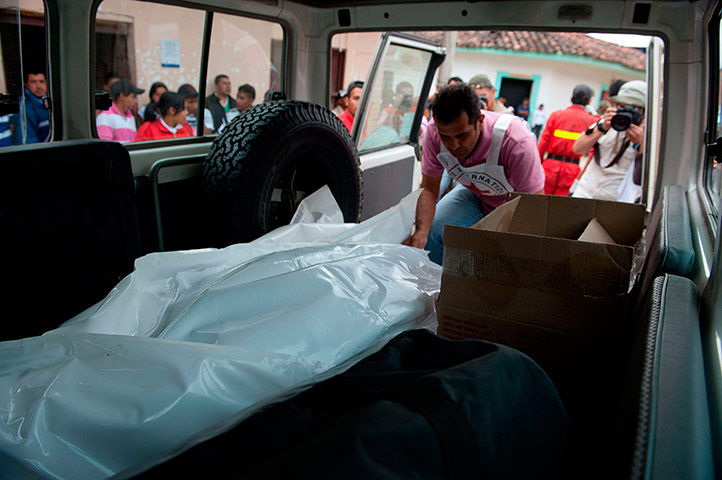 FARC in Colombia: A member of the ICRC collects bodies sht down by FARC