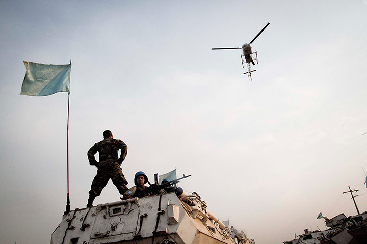 24 hours: A United Nations helicopter circles over a U.N. peacekeeper