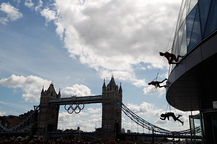 Streb Dance London: Members of Streb abseil down the face of City Hall, Tower Bridge behind