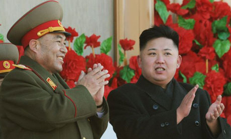 Ri Yong-ho, shown with the country's young leader, Kim Jong-un