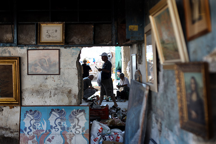 24 hours: Athens, Greece: People look at second hand goods in a flea market