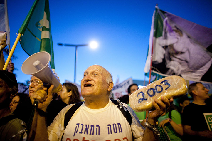 Tel Aviv protests: Protesters march through the streets in Tel Aviv