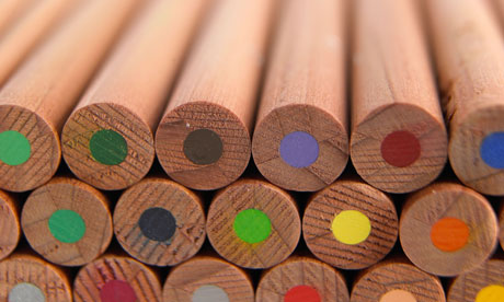 A stack of wooden coloured / colored pencils