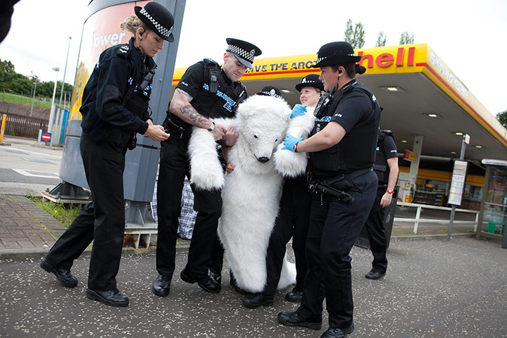 Picture desk live: A Greenpeace activist is removed from a Shell garage in Edinburgh 