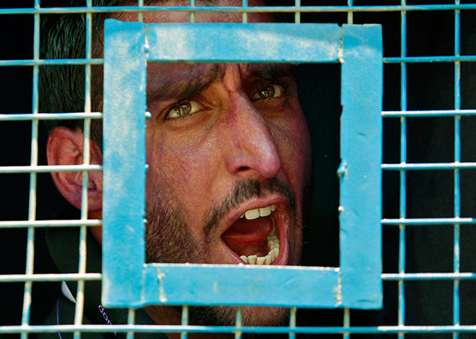 Picture desk live: A teacher detained in Kashmir after protesting over pay and conditions