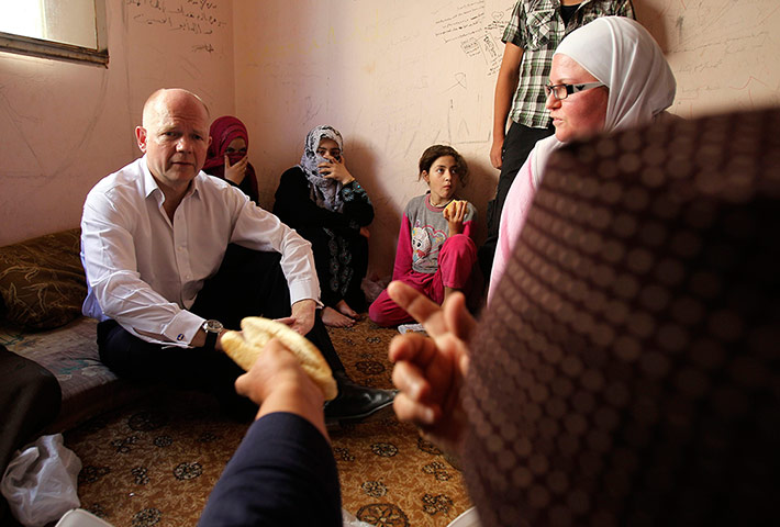 Picture desk live: British Foreign Minister Hague visits Syrian refugees in Jordan