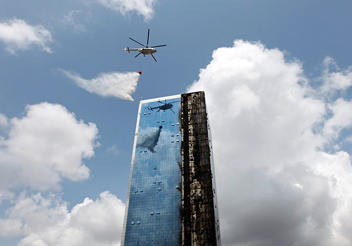 24 hours: Istanbul, Turkey: A helicopter releases water at a fire at a tower block