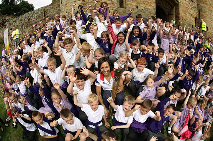 Picture desk live: Dame Kelly Holmes brings the Olympic torch to her old school