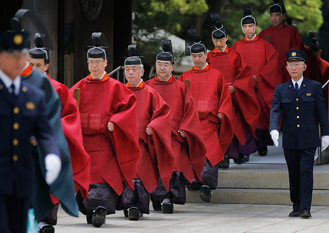 Picture Desk Live: Shinto priests march as Japan's Emperor Akihito visits