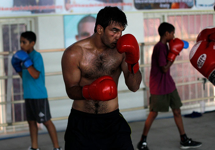 Boxing in India: Manjeet Singh from Bhiwani Boxing Club practices during a training session