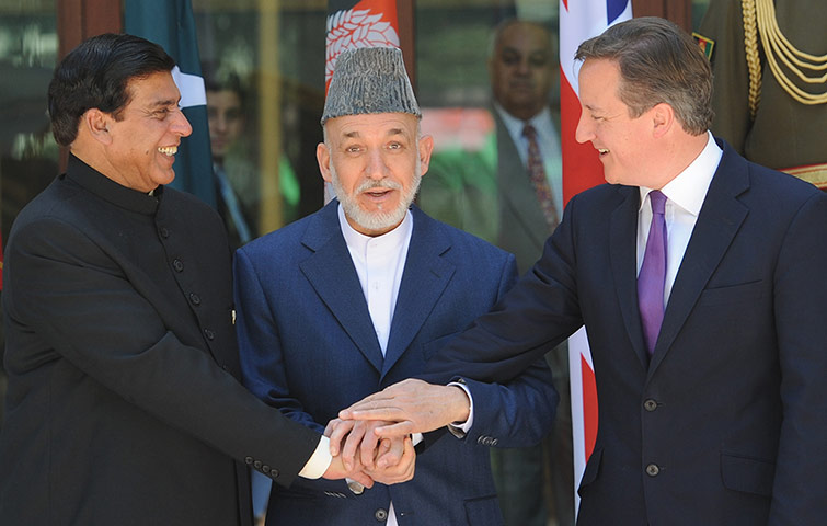 Picture desk live: David Cameron meets Hamid Karzai and Raja Pervez Ashfraf in Kabul