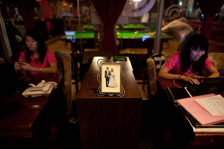 24 hours: Beijing, China: A picture of a bride and groom on display at a singles club