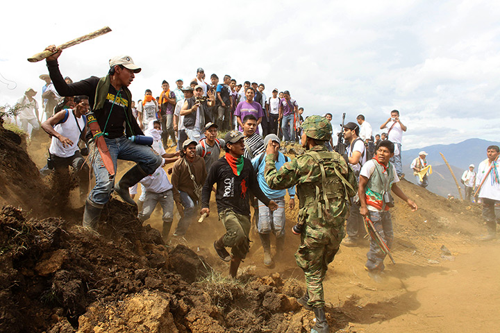 Civil unrest in Colombia: Nasa Indians charge on a soldier in Toribio, southern Colombia