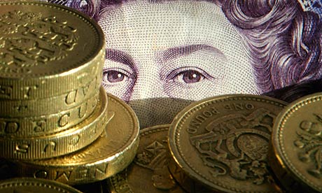 Close up of pound coins and note