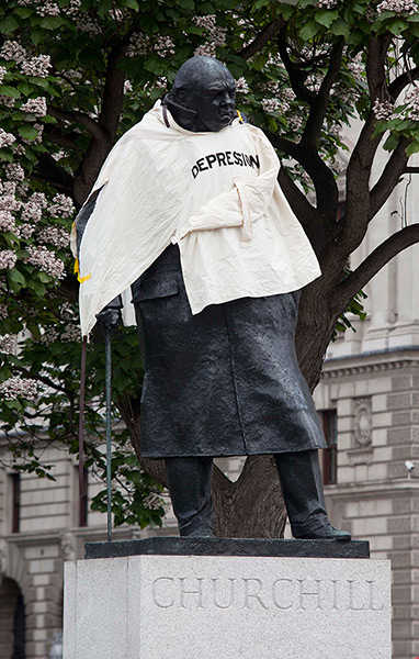 Picture desk live updated: Statue of Sir Winston Churchill in Parliament Square with a straitjacket