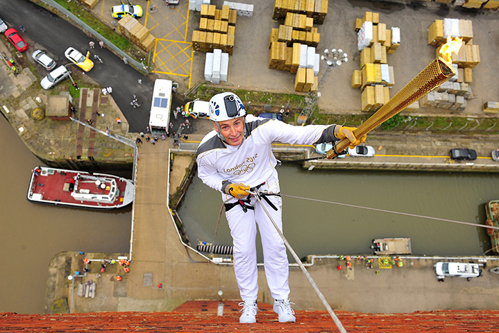 Torch relay: 27 June, Grimsby: Alan Ellinson abseils with the flame