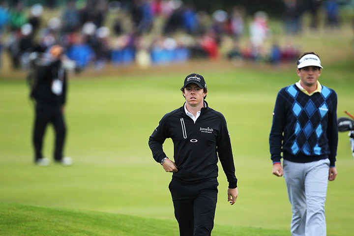 Open Golf day 1: A thoughtful Rory McIlroy walks along the 14th