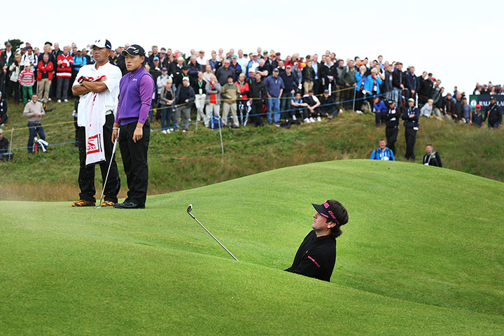 Open Golf day 1: Bubba Watson plays out of a green side bunker on the 7th