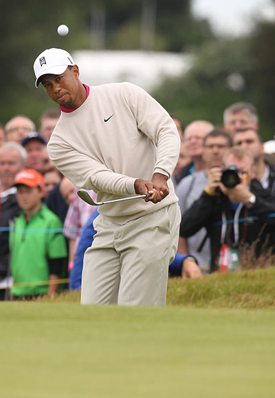 Open Golf day 1: Tiger Woods chips onto the 7th green
