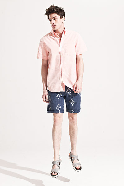 All Ages: Male model wears pale pink shirt and blue patterned shorts
