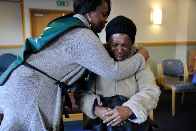 Foodbank gallery: 8 Woman being helped at a foodbank
