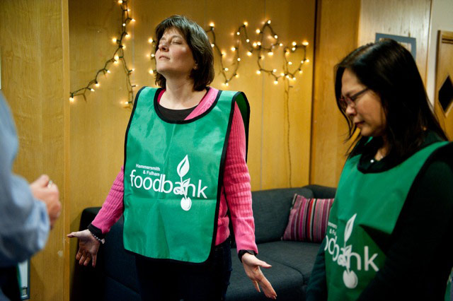 Foodbank gallery: 10 Women praying at foodbank