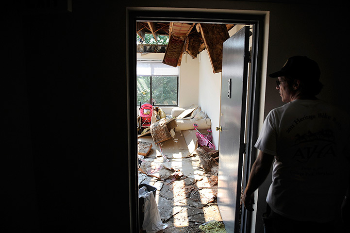 US storms: A building manager surveys one of the storm-damaged apartments